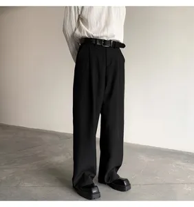 Detail shot of stylish mens black trousers and leather belt with pin buckle for daily wear.