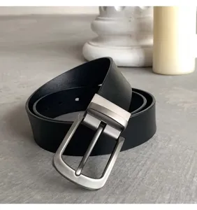 Men's business casual black belt with silver metal pin buckle, high quality detail shot.