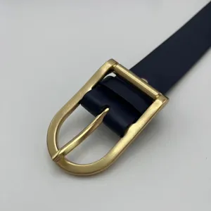 Women's stylish thin belt with gold pin buckle, elegant dark blue dress accessory main view.