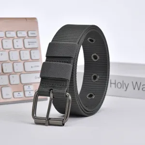 Close-up detail of dark grey canvas belt with metal pin buckle and multiple eyelet holes.