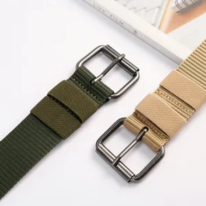 Detailed shot of canvas belt with metal pin buckle, durable woven fabric strap for casual wear.