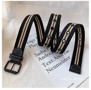 Women's canvas belt casual stylish striped waistband with metal buckle and eyelets.