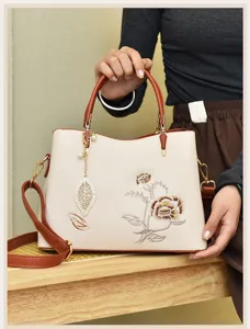Elegant embroidered women handbag with top handle and strap, stylish daily casual shoulder bag.