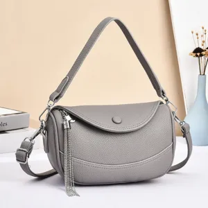 Grey leather shoulder bag with tassel chain, stylish large capacity crossbody handbag for women.