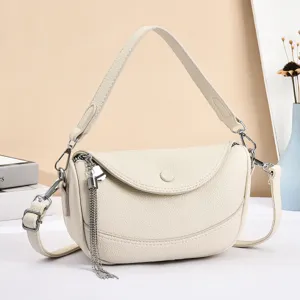 Elegant white leather shoulder bag with chic metal tassel chain and flap closure.