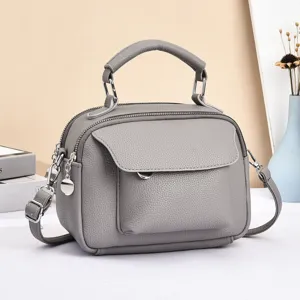 Grey leather crossbody bag for women, multi-compartment casual shoulder handbag with top handle.