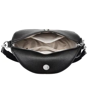 Detailed view of black leather crossbody shoulder bag with chevron lining and silver hardware.
