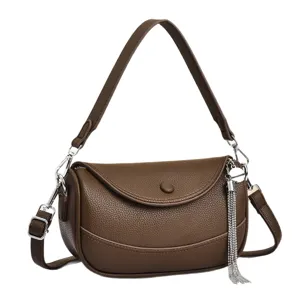 Trendy brown leather women shoulder bag crossbody handbag with chic tassel and silver hardware.