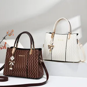 Stylish women's handbag set, large capacity elegant shoulder bag and crossbody bag with bow charm.