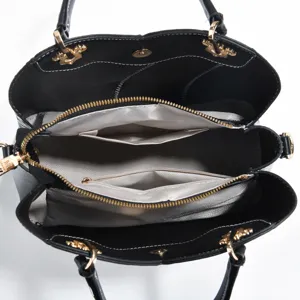 Classic black tote handbag with multi-compartment interior, golden hardware and shoulder strap.