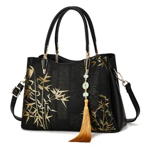 Elegant black handbag with Chinese style gold bamboo print, tote and shoulder bag for women.