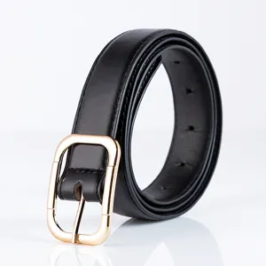 Black leather belt detail showcasing the classic golden metal buckle and fine stitching texture.