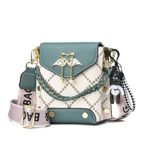 Stylish green and white crossbody bag with elegant swan clasp, chain strap and cute bear charm.