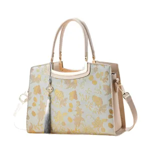 Elegant Chinese style embroidered tote bag with top handle and tassel, large capacity shoulder bag.