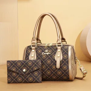 Classic brown monogram leather handbag and wallet set, elegant vintage boston pillow bag.