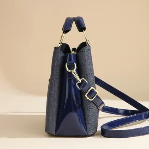 Elegant dark blue PU leather women shoulder tote bag side detail with chic gold hardware.