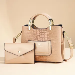 Detailed view of women PU leather handbag and clutch set with crocodile texture and gold hardware.