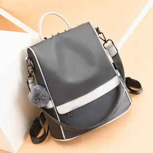 Stylish grey and white women backpack casual travel school bag with cute fluffy pompom charm