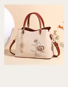 Elegant women's handbag with Chinese style floral embroidery, tote and crossbody design.