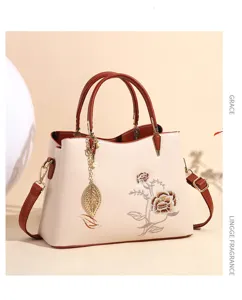 Elegant women top handle handbag with floral embroidery chic shoulder bag for daily wear.