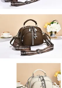 Stylish brown leather shoulder bag with wide strap, tassel and cute silver pendant.
