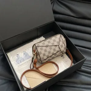 Stylish women shoulder crossbody bag with retro monogram pattern and brown leather straps.