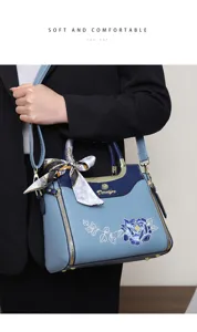 Elegant embroidered handbag detail showcasing delicate peony pattern and stylish silk scarf.
