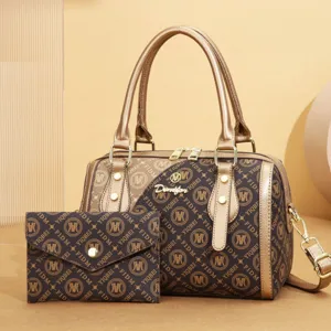 Women vintage monogram Boston bag shoulder crossbody handbag with matching pouch detail.