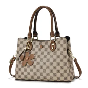 Elegant women's retro monogram shoulder bag with stylish flower charm and large capacity.