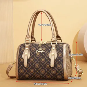 Vintage retro monogram bowler handbag with top handle and strap for women detailed view.