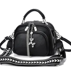 Black leather crossbody bag for women with wide strap, multi-layer zipper and stylish charm.