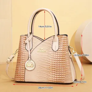 Vista dettagliata della borsa tote in pelle goffrata coccodrillo rétro con logo metallico.