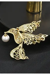 Elegant gold bird brooch with shining pearl and zircon inlay for women, luxury fashion accessory.