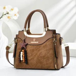 Stylish brown PU leather women handbag with top handle, embossed pattern and cross-body strap.