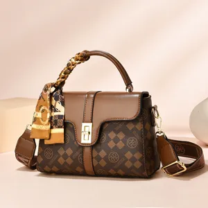 Stylish brown checkered women handbag with chic scarf handle and adjustable strap.