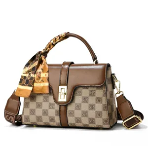 Chic brown checkered cross-body handbag featuring top handle and stylish printed silk scarf.