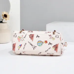 Pink women shoulder bag with cute travel print, stylish daily handbag with metal feet.