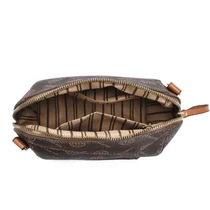 Detailed view of the brown monogram crossbody bag interior, with zippers and fabric lining.