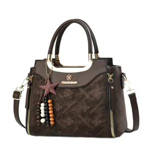 Stylish brown women's shoulder bag with monogram print, large capacity and stylish design.