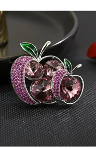 Exquisite crystal apple brooch detail shot, sparkling zircon and pink crystal pendant design.