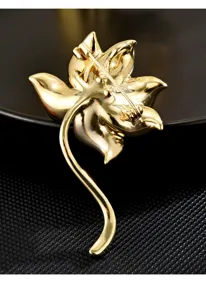 Detail view of the elegant lotus flower brooch back showing pin clasp and fine metal finish.