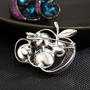 Exquisite apple shape brooch pin with sparkling colorful zircon crystals for women fashion wear.