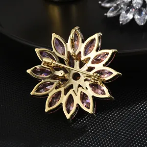 Exquisite gold-tone flower brooch with sparkling purple marquise zirconia crystals main view