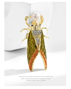 Exquisite rhinestone cicada brooch detail featuring a glossy freshwater pearl and vibrant enamel wings.