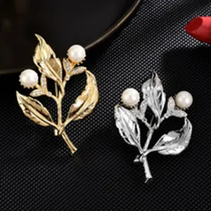 Pearl leaf brooch detail shot, elegant gold and silver floral lapel pin for women coats.