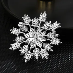 Exquisite silver-tone zircon snowflake brooch pin, elegant floral design jewelry accessory.
