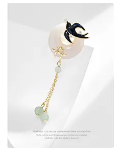 Exquisite Chinese style swallow tassel brooch featuring jade safety buckle and green beads.