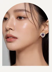 Close-up detail of dazzling heart-shaped stud earrings with sparkling diamond halo for women.