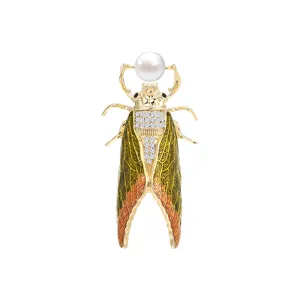 Elegant gold cicada brooch with freshwater pearl and crystal rhinestones for women fashion.
