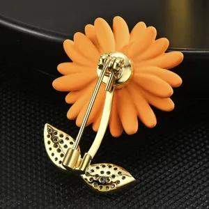 Elegant orange sunflower brooch with gold plated rhinestone leaves, exquisite fashion pin accessory.